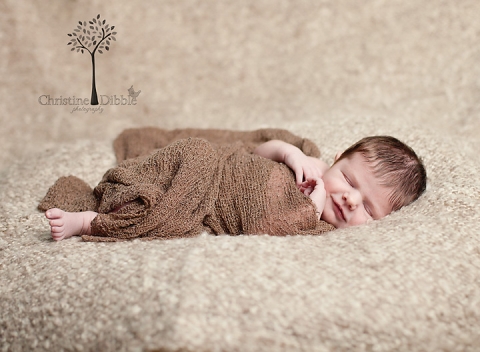 newborn baby smiling