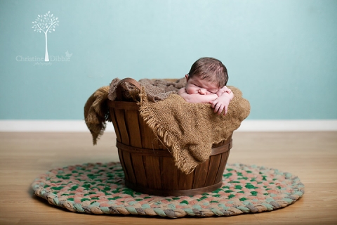 newborn in basket