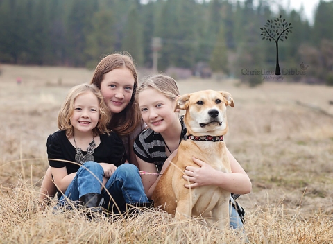 Three girls and dog