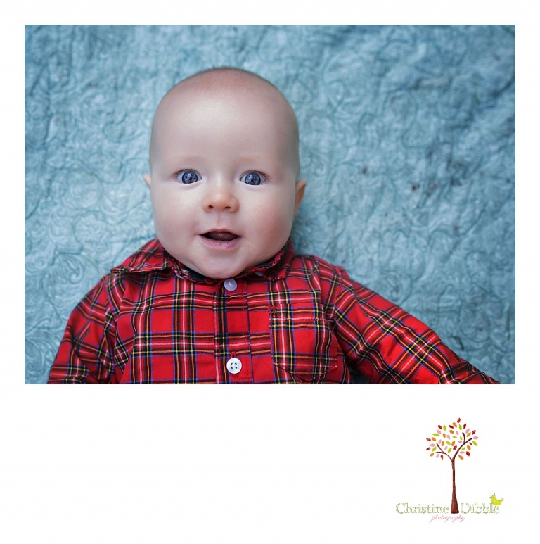 Sonora childrens photographer Christine Dibble Photography takes photos of a baby boy smiling on a quilt during Twain Harte Tree Farm mini sessions.