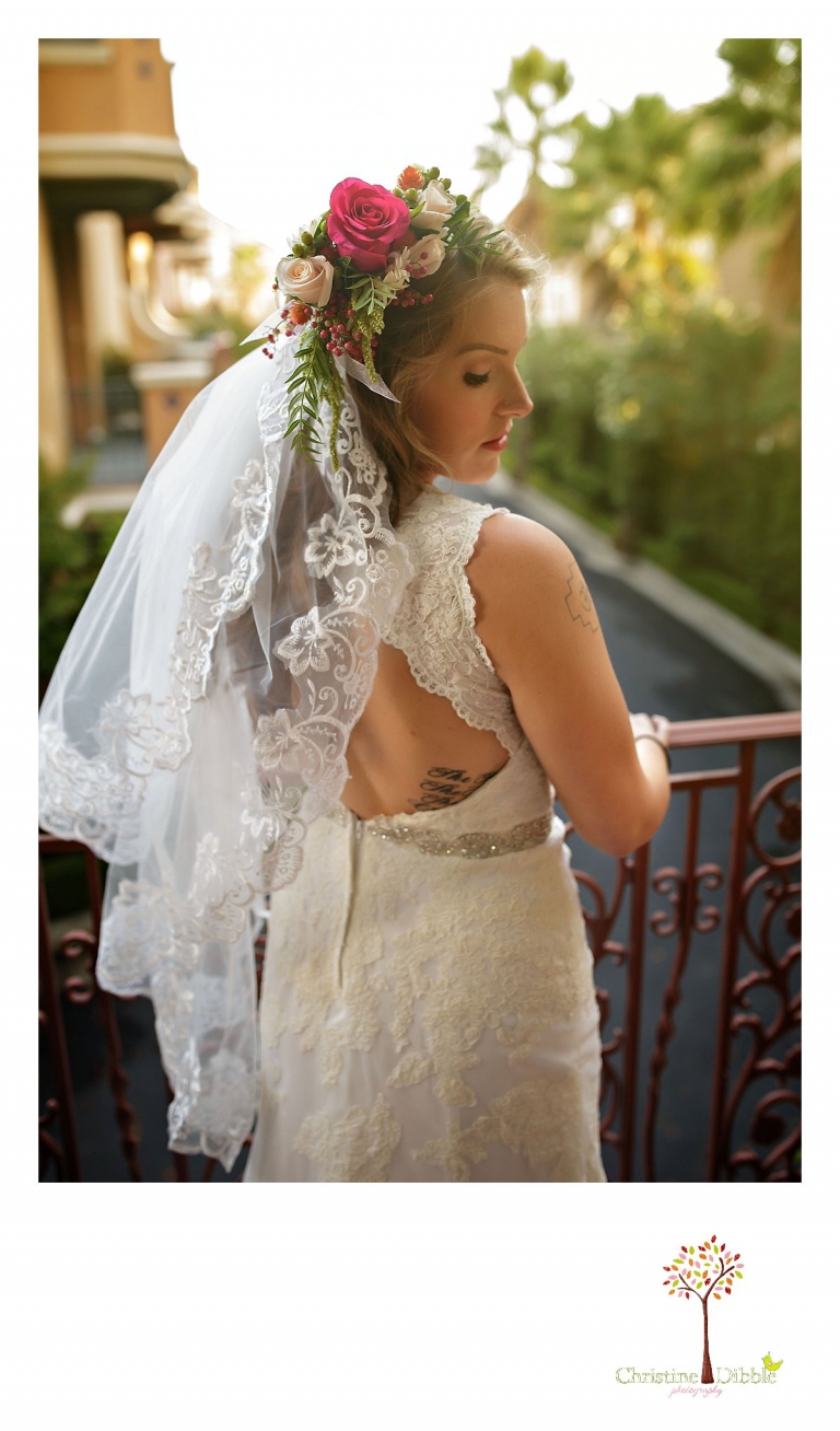 Sonora wedding photographer Christine Dibble Photography  photographs the bride on a balcony before her  sunset beach wedding at Moran Lake Beach in Santa Cruz.