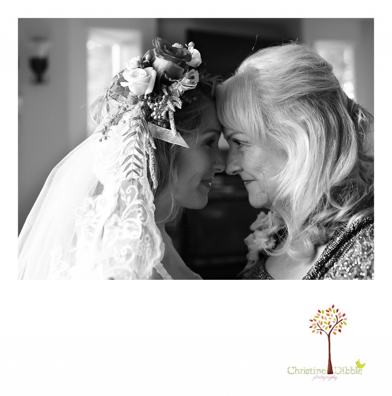 Sonora wedding photographer Christine Dibble Photography  photographs the brideand her mother in an emotional moment before her  sunset beach wedding at Moran Lake Beach in Santa Cruz.