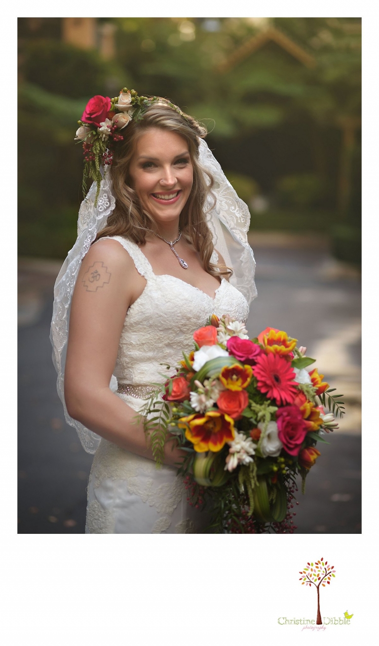 Sonora wedding photographer Christine Dibble Photography  photographs the bride in her dress and veil and flower head wreath before  a sunset beach wedding at Moran Lake Beach in Santa Cruz.