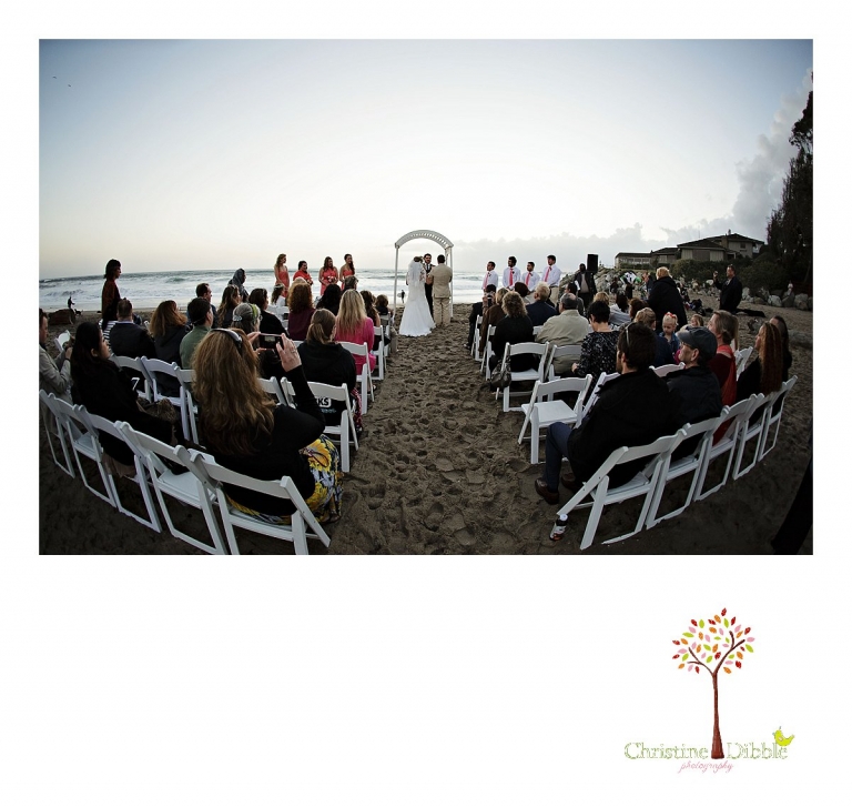 Sonora wedding photographer Christine Dibble Photography  photographs a sunset beach wedding at Moran Lake Beach in Santa Cruz with a wide angle fish eye lens.