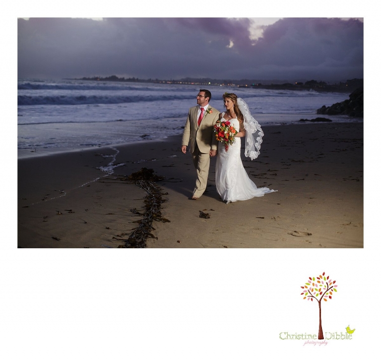 Sonora wedding photographer Christine Dibble Photography  photographs a bride and groom with lights after their  sunset beach wedding at Moran Lake Beach in Santa Cruz.