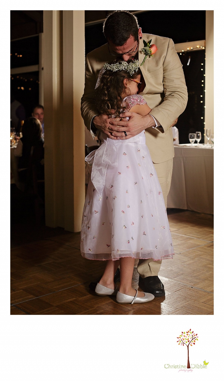 Sonora wedding photographer Christine Dibble Photography  photographs the groom dancing with his young daughter after a sunset beach wedding at Moran Lake Beach in Santa Cruz.