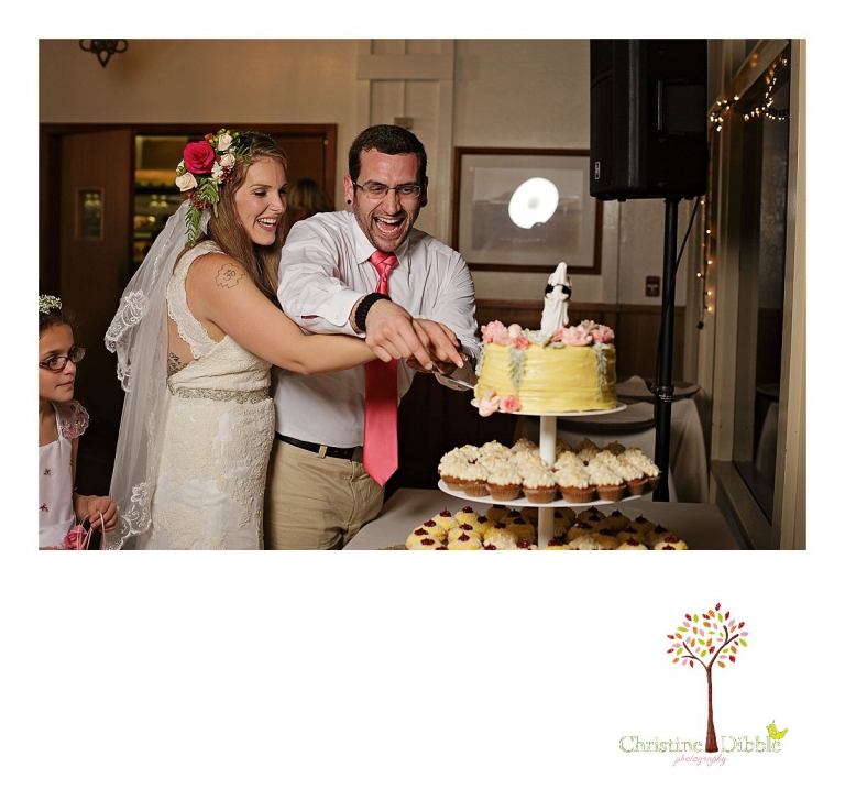 Sonora wedding photographer Christine Dibble Photography  photographs the bride and groom cutting the cake after a sunset beach wedding at Moran Lake Beach in Santa Cruz.
