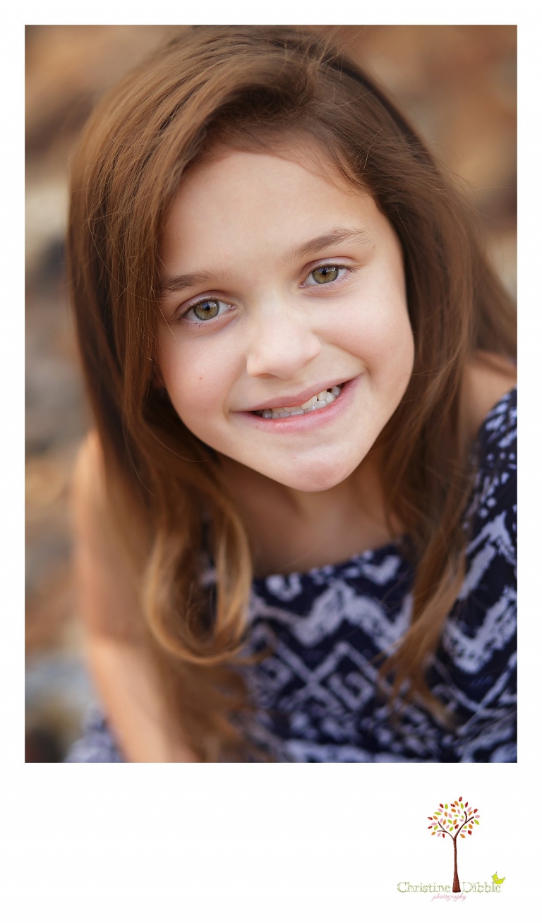 Sonora and Murphys family photographer  Christine Dibble Photography takes head shot photos of a young girl during a Murphys family photography session.