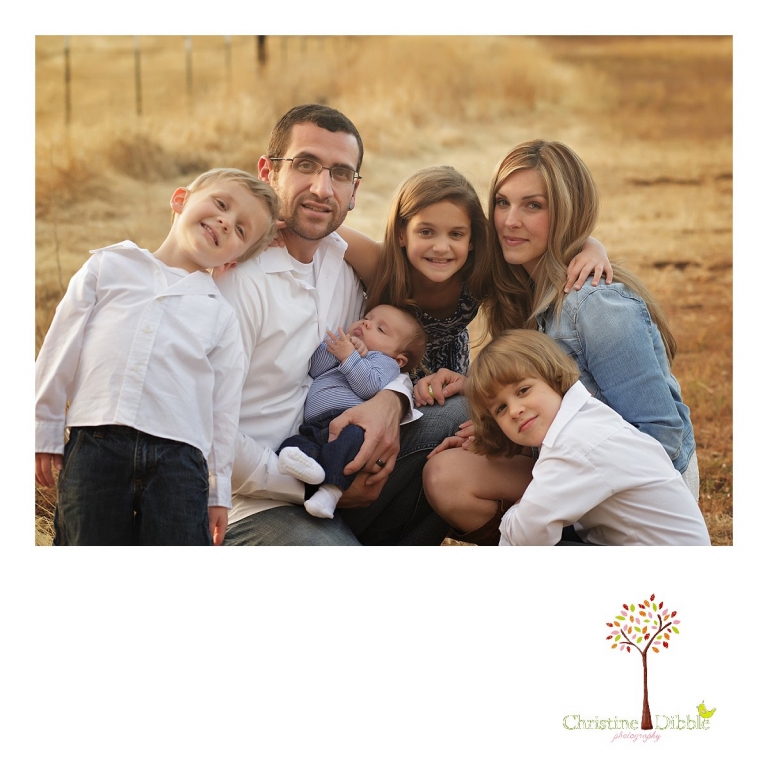 Sonora and Murphys family photographer  Christine Dibble Photography takes photos of a family surrounding their new baby boy during a Murphys family photography session.