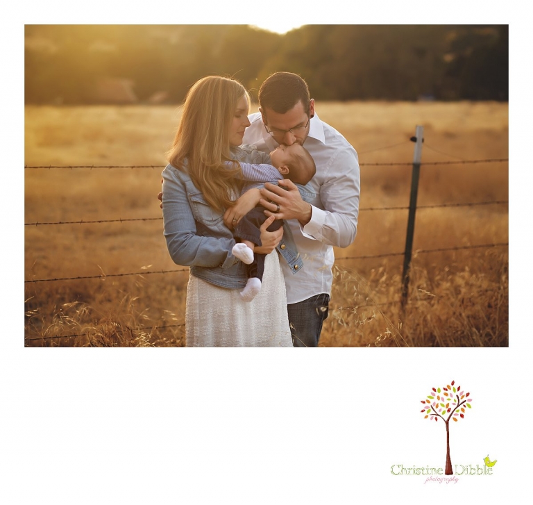 Sonora and Murphys family photographer  Christine Dibble Photography takes photos of a newly married couple admiring their new baby boy during a Murphys family photography session.