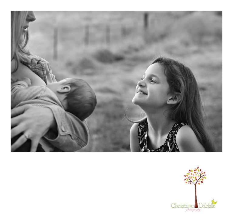 Sonora and Murphys family photographer  Christine Dibble Photography takes photos of a big sister admiring her new baby brother as he nurses during a Murphys family photography session.