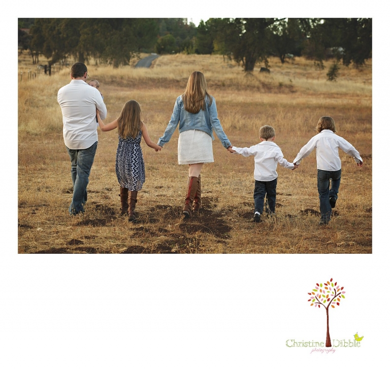 Sonora and Murphys family photographer  Christine Dibble Photography takes photos of a family walking together during a Murphys family photography session.