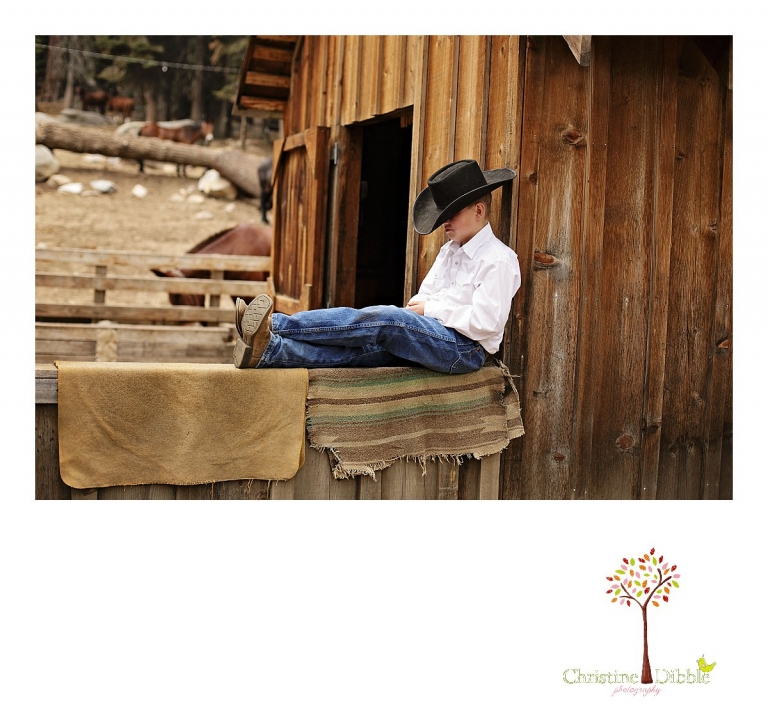 A little cowboy rests on a fence at Aspen Meadows while Christine Dibble photographs him.