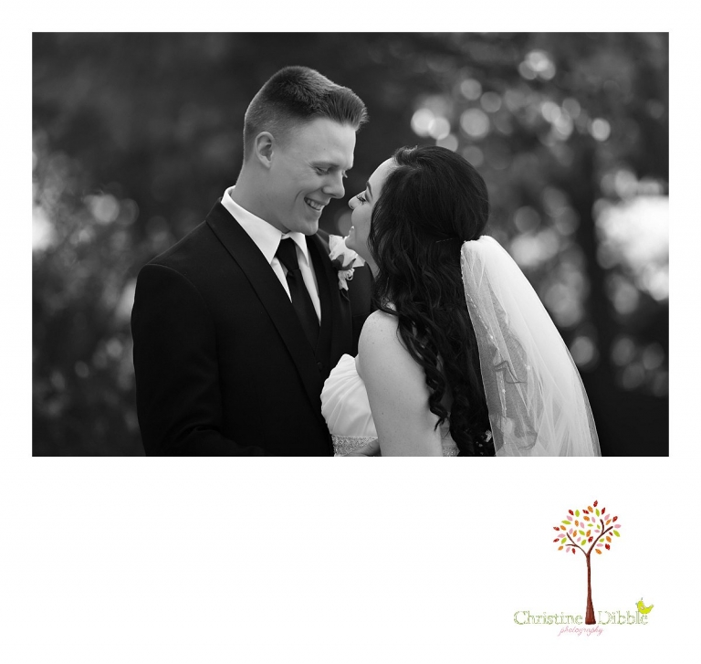 Christine Dibble Photography, Sonora and Reno wedding photographer, photographs a bride and groom in black and white as they pose in botanical gardens after their Rancho San Rafael Park wedding.