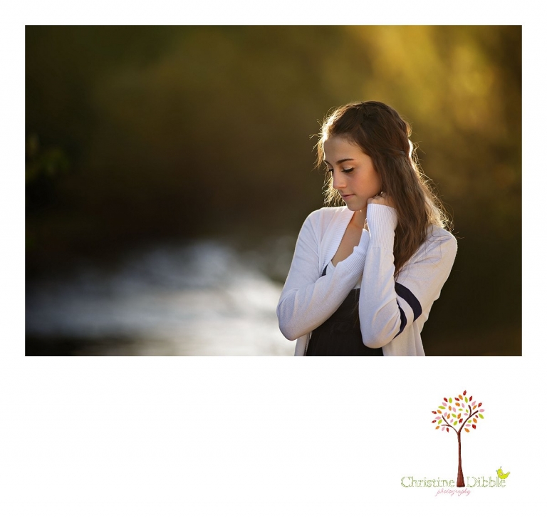 Sonora and Summerville senior portrait photographer Christine Dibble Photography takes outdoor photos of a senior girl during golden hour on the banks of the river at Knights Ferry.