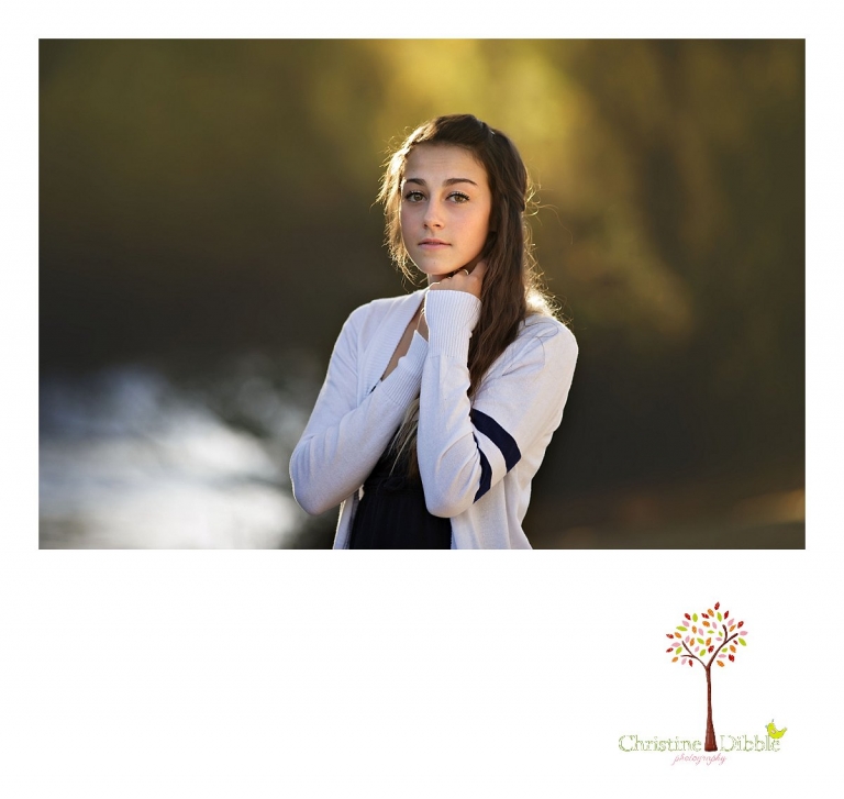 Sonora and Summerville senior portrait photographer Christine Dibble Photography takes outdoor photos of a senior girl during golden hour on the banks of the river at Knights Ferry.