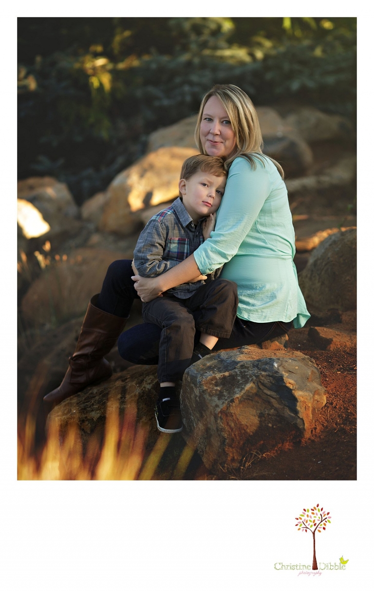 Sonora photography by Christine Dibble Photography captures photos of a little boy hugging his mom during mini sessions at Sierra College in Grass Valley.