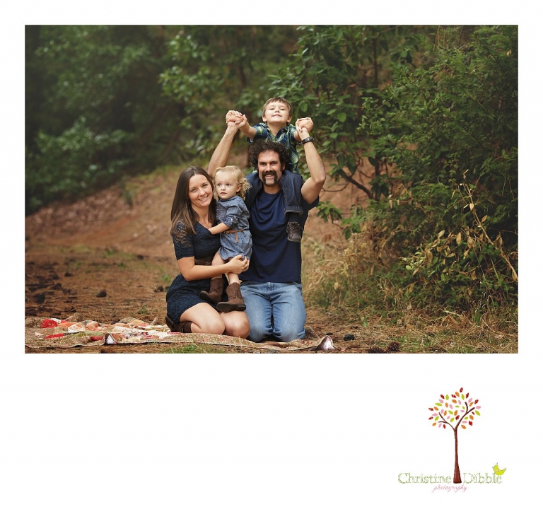 Sonora photography by Christine Dibble Photography captures photos of a family playing on a quilt during mini sessions at Empire Mine State Park in Grass Valley.