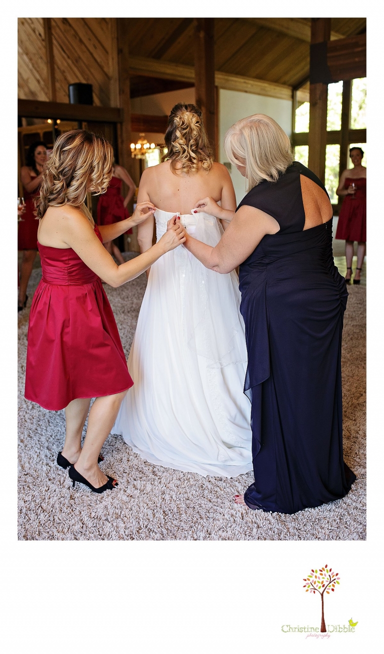Christine Dibble Photography of Sonora photographs the bride's mother and sister helping her dress before her Indigeny Reserve wedding.
