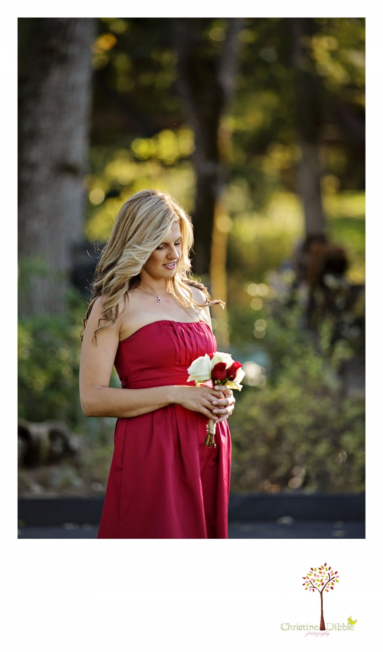 Christine Dibble Photography of Sonora photographs a bridesmaid start down the aisle at an outdoor Indigeny Reserve wedding.