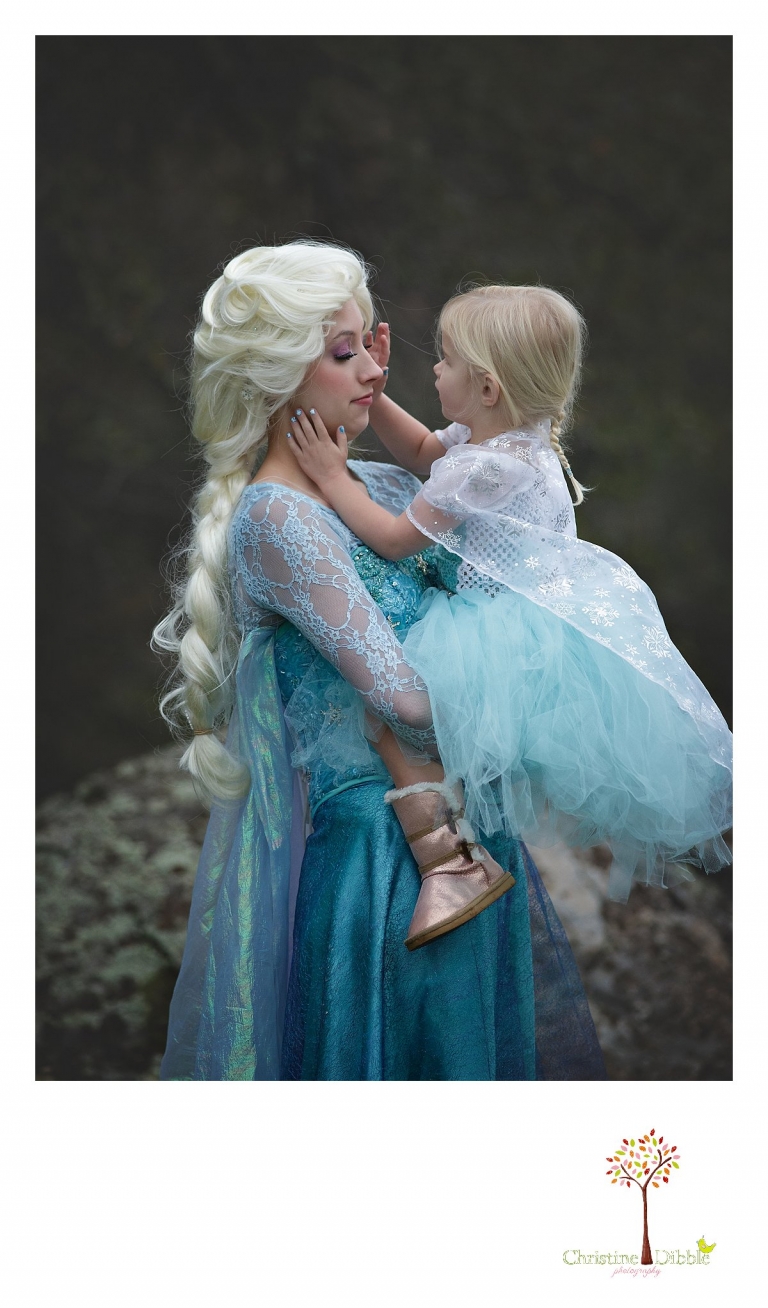 Sonora Elsa photographer Christine Dibble Photography photographs the beautiful princess Elsa as a little girl brushes stray hair out of her face.