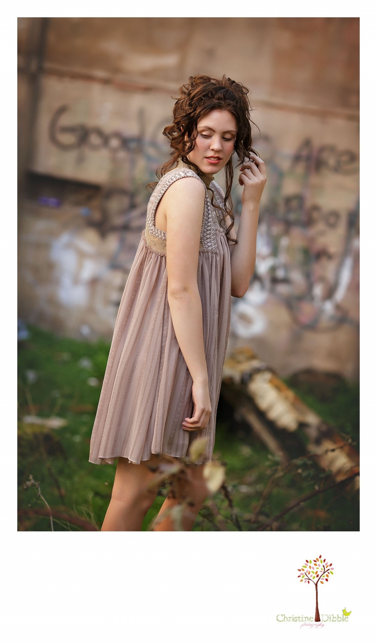 Sonora, CA senior model photographer Christine Dibble takes outdoor modeling photos of a teenage girl for a modeling portfolio while she wears a Free People dress from Tar Flat Antiques.