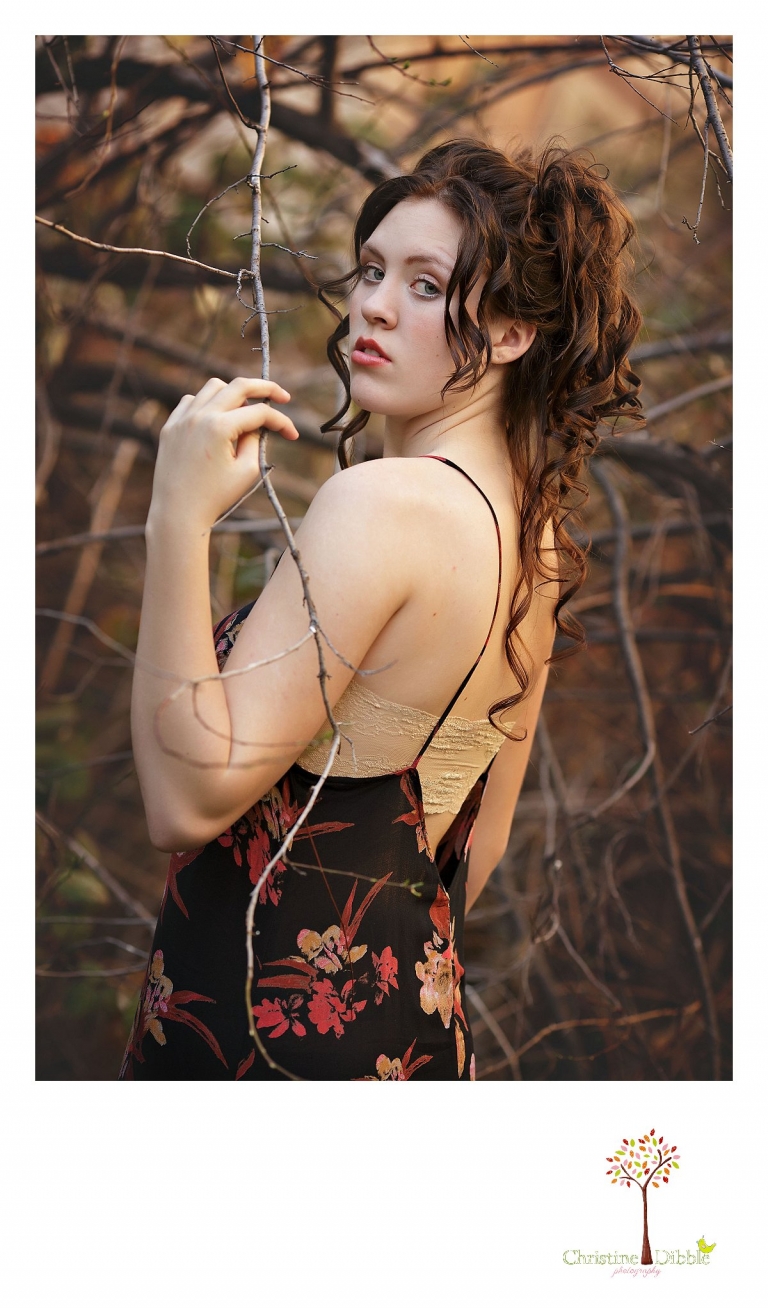 Sonora, CA senior model photographer Christine Dibble takes outdoor modeling photos of a teenage girl for a modeling portfolio while she wears Free People and a curly up-do.