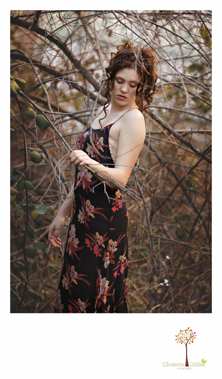 Sonora, CA senior model photographer Christine Dibble takes outdoor modeling photos of a teenage girl for a modeling portfolio wearing Free People and curly hair.