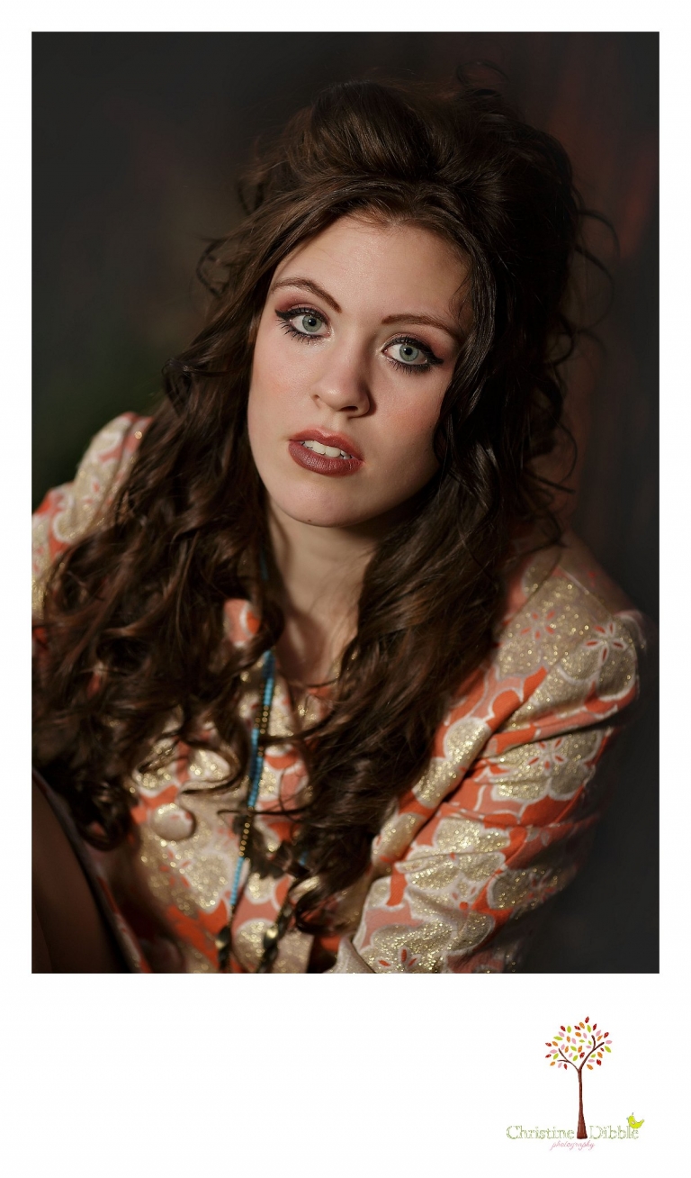 Sonora, CA senior model photographer Christine Dibble takes outdoor modeling photos of a teenage girl for a modeling portfolio while she wears dramatic make-up for a head shot.