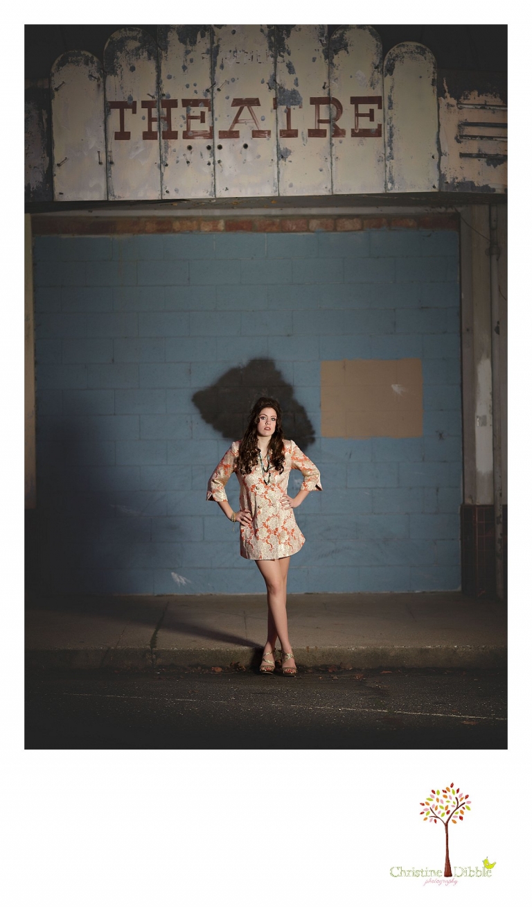 Sonora, CA senior model photographer Christine Dibble takes outdoor modeling photos of a teenage girl for a modeling portfolio while she wears a glittery gold and orange mod-style vintage coat.