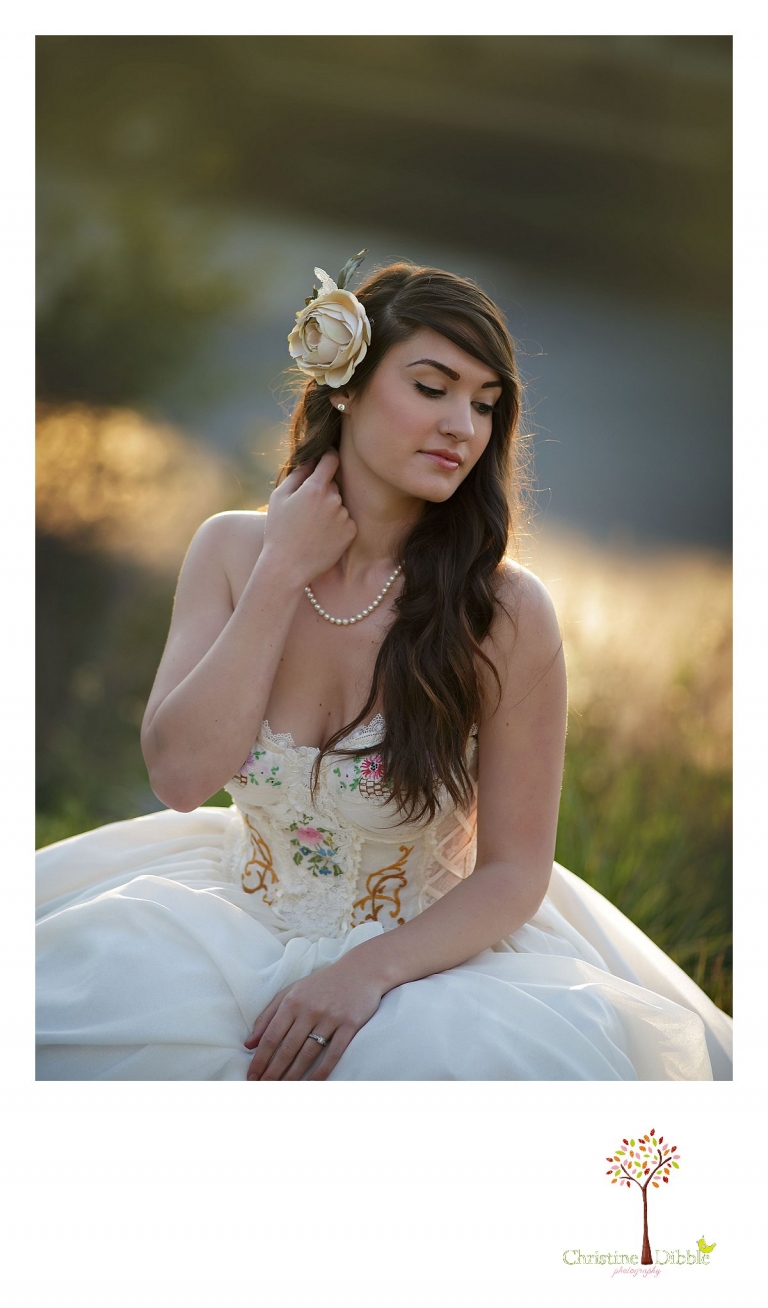 Sonora wedding photographer Christine Dibble Photography takes outdoor sunset photos of a model wearing a dress crafted of vintage linens and a hair flower by Hopefully Romantic near Twain Harte.