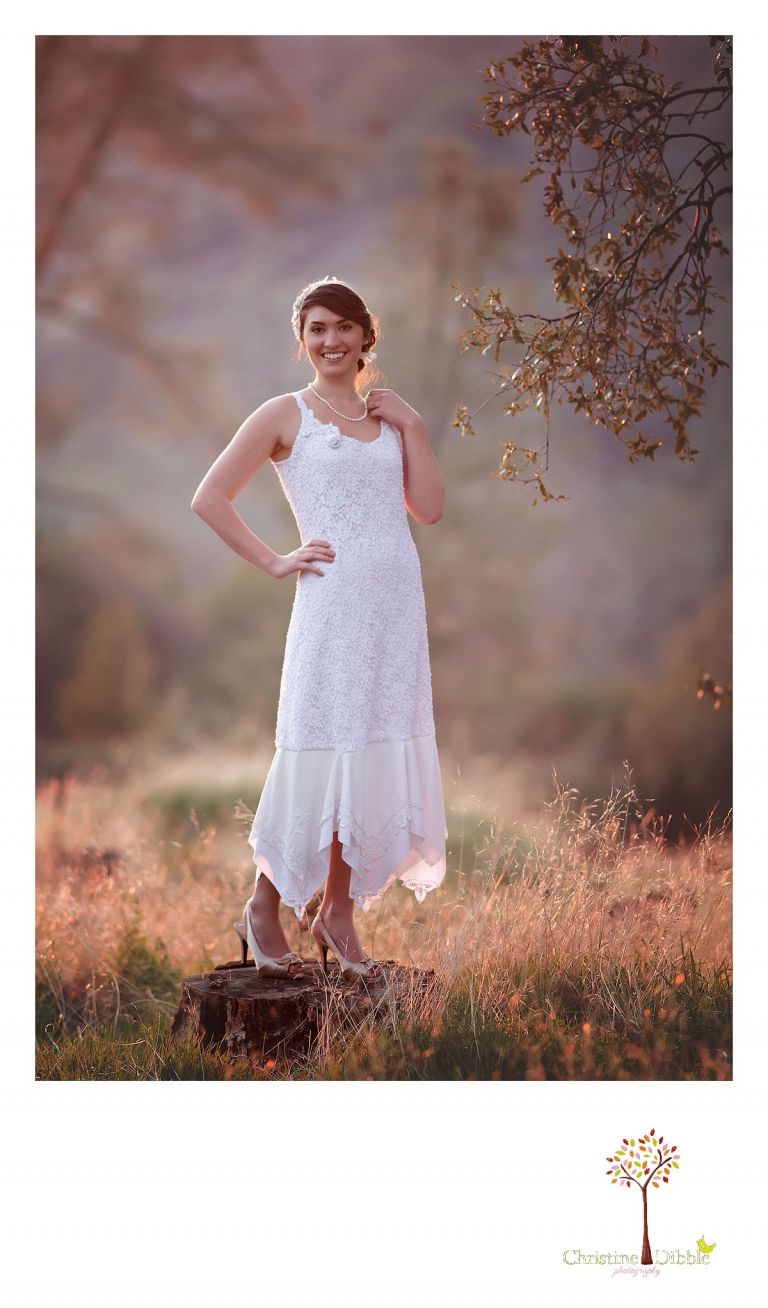 Sonora wedding photographer Christine Dibble Photography takes outdoor sunset photos of a model wearing a dress crafted of vintage linens  made by Hopefully Romantic near Twain Harte.
