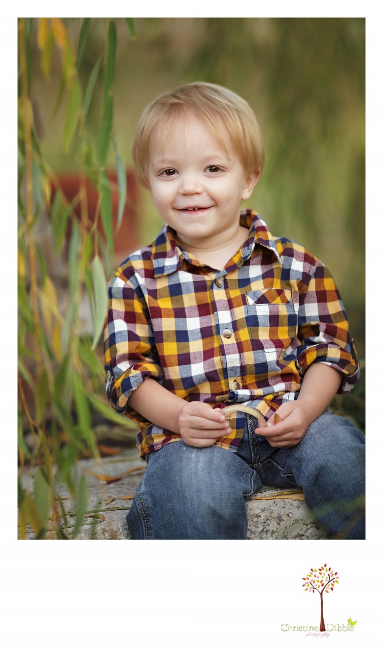 Best Sonora family photographer Christine Dibble Photography coaxes a smile from a little boy for an outdoor portrait session.
