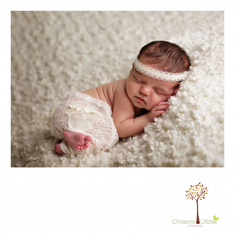 Sonora, CA newborn photography session by best Sonora newborn photographer Christine Dibble Photography includes photos of a baby girl as she sleeps in pants and a headband by Bonnie's Bonnets.