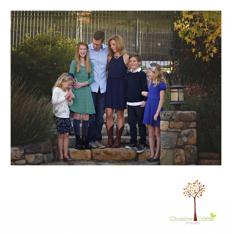 Christine Dibble Photography, best Sonora family photographer, takes outdoor portraits of a blended family on the stone steps in their renovated backyard in Tuolumne.