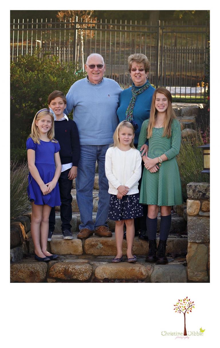 Christine Dibble Photography, best Sonora family photographer, takes outdoor portraits of a blended family and grandparents in their renovated backyard in Tuolumne.