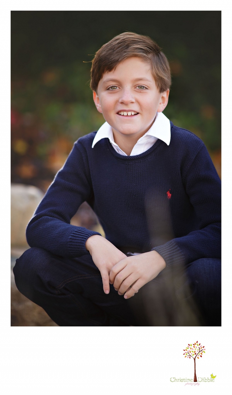 Christine Dibble Photography, best Sonora family photographer, takes outdoor individual portraits of a boy during a blended family shoot in their renovated backyard in Tuolumne.