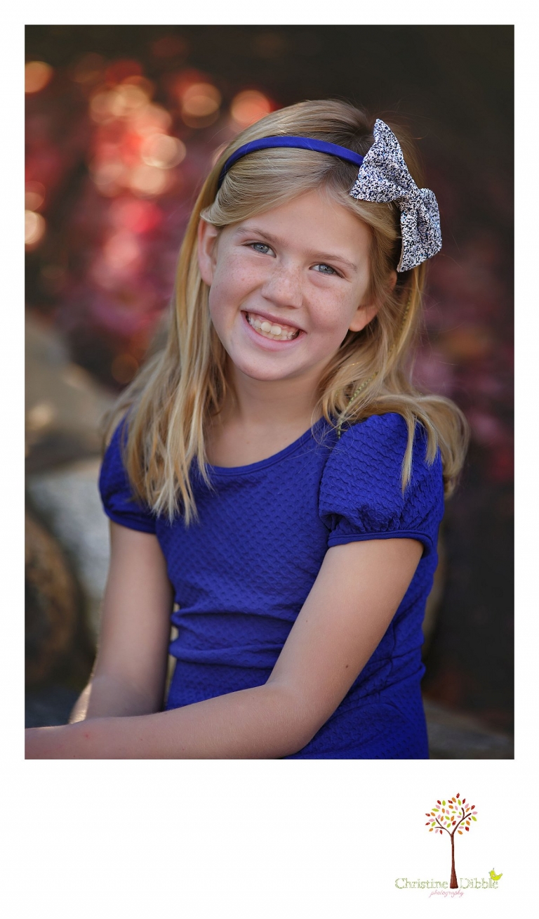 Christine Dibble Photography, best Sonora family photographer, takes individual outdoor portraits of a girl during a blended family shoot in their renovated backyard in Tuolumne.