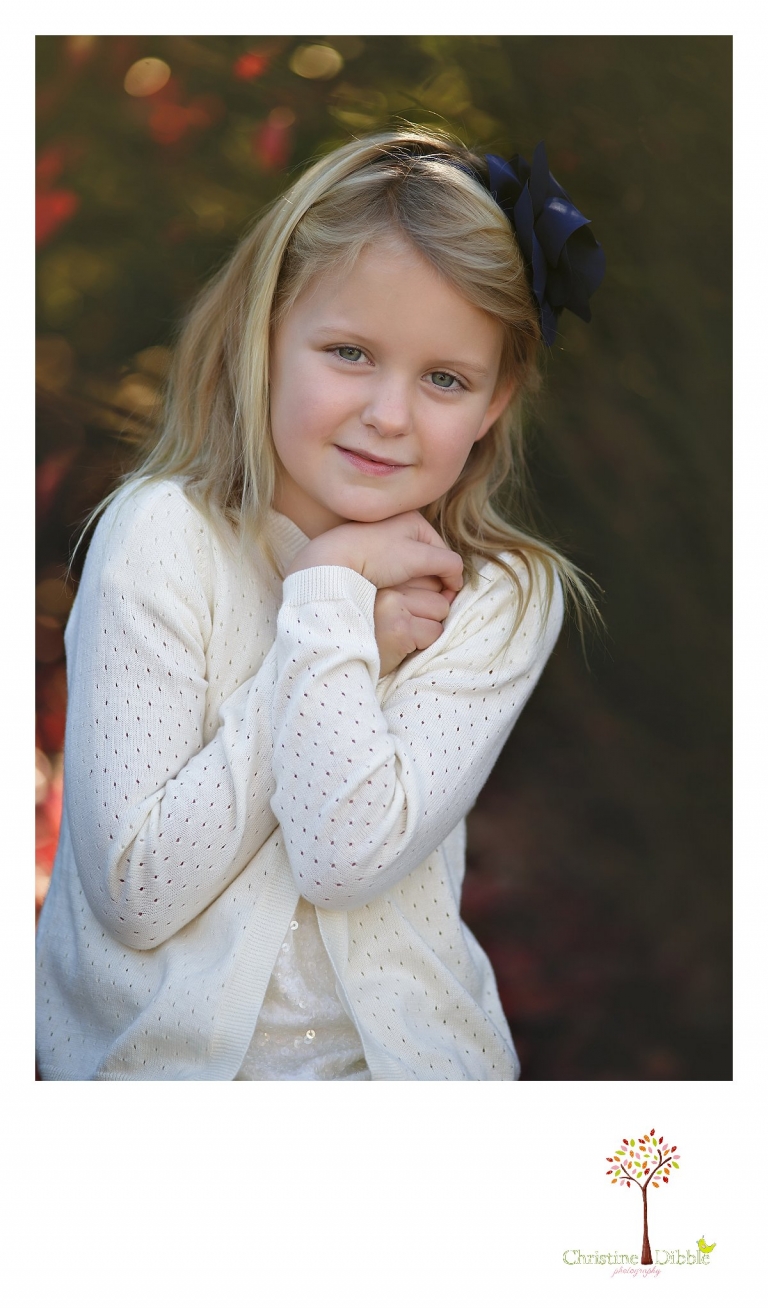 Christine Dibble Photography, best Sonora family photographer, takes individual outdoor portraits of a little girl with her blended family in their renovated backyard in Tuolumne.