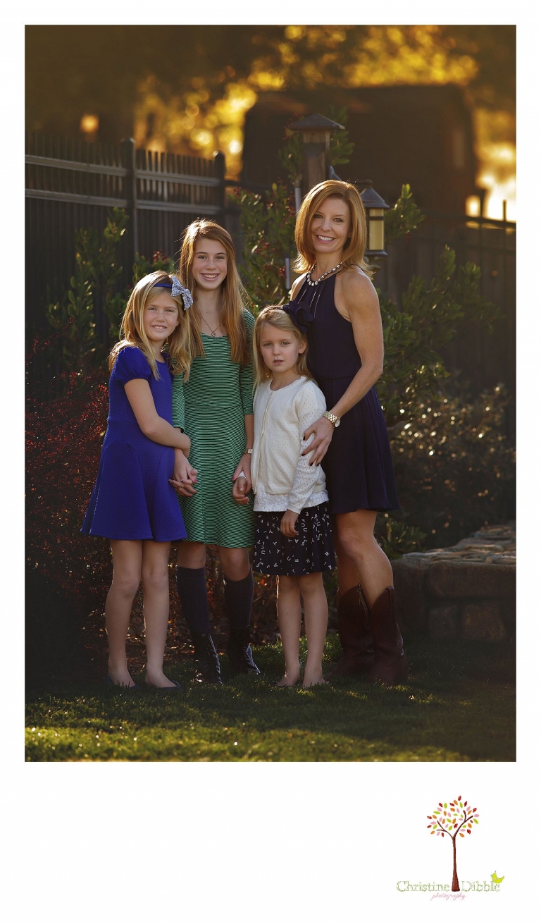 Christine Dibble Photography, best Sonora family photographer, takes outdoor portraits of a mom and her girls during their  blended family photo session in their renovated backyard in Tuolumne.