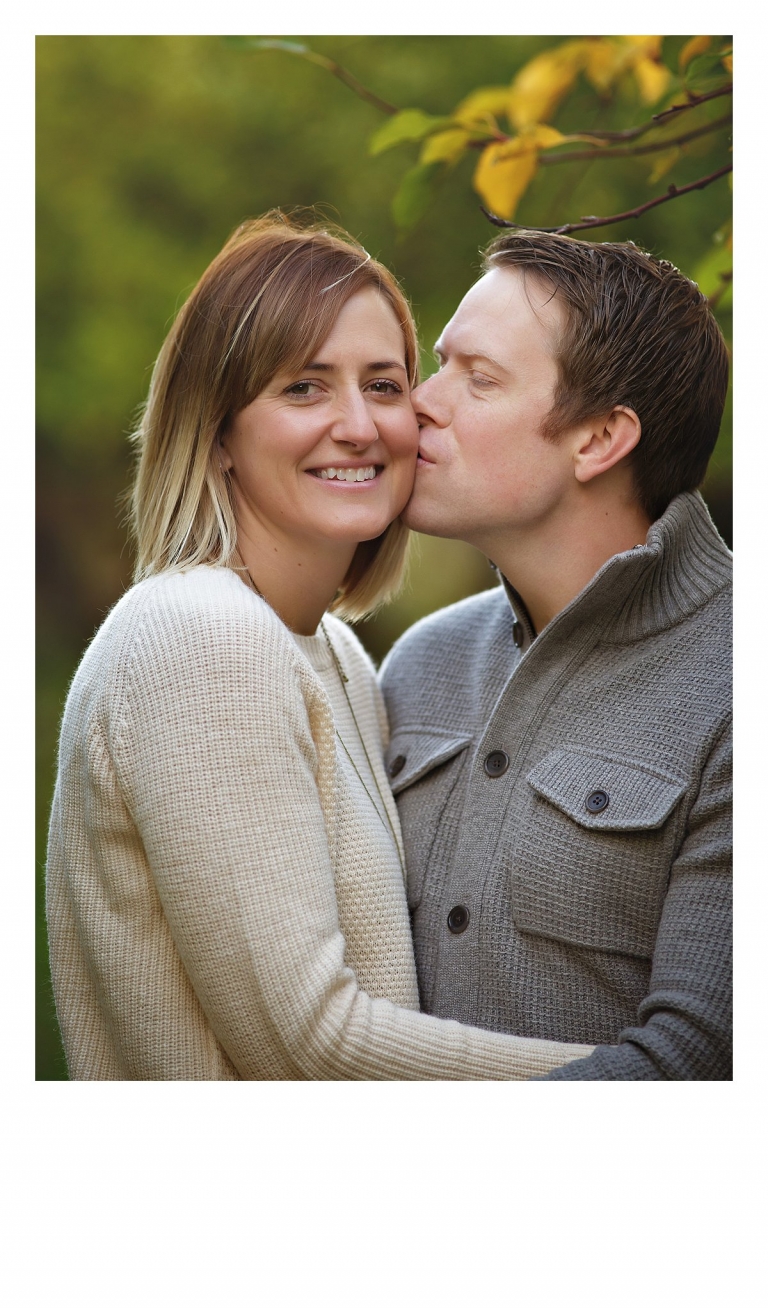 A husband and wife and parents are photographed together during a Sonora, CA family photography session at Indigeny Reserve by Christine Dibble Photography.
