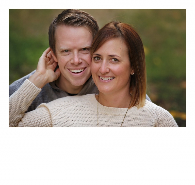 A husband and wife cuddle for the camera without their children in the photo for a Sonora, CA family photography session at Indigeny Reserve by Christine Dibble Photography.
