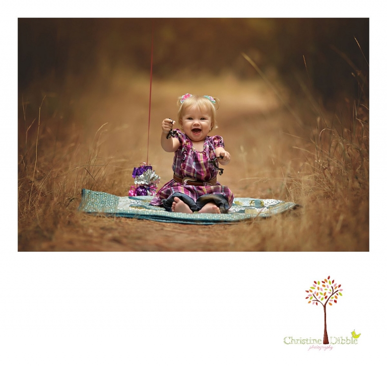 A little girl has her first birthday session including giant balloons with Sonora baby and child portrait photographer Christine Dibble Photography near Twain Harte.