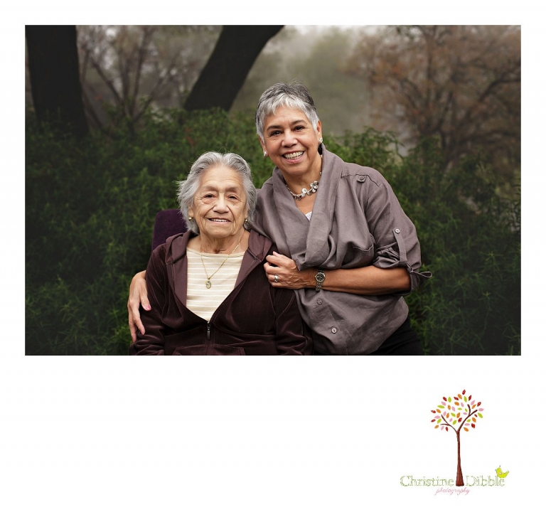 Sonora photographer Christine Dibble Photography takes a photo of a mom grown daughter during a four generation family portraits outside on a foggy morning in the clients' yard.