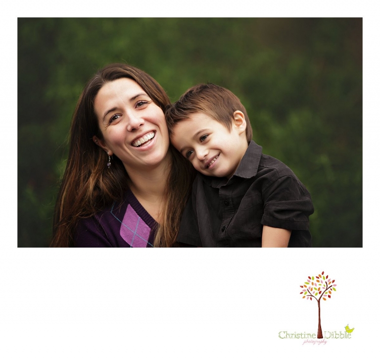 Sonora photographer Christine Dibble Photography takes a portrait of a son with his head on mom's shoulder during a  four generation family portraits outside on a foggy morning in the clients' yard.