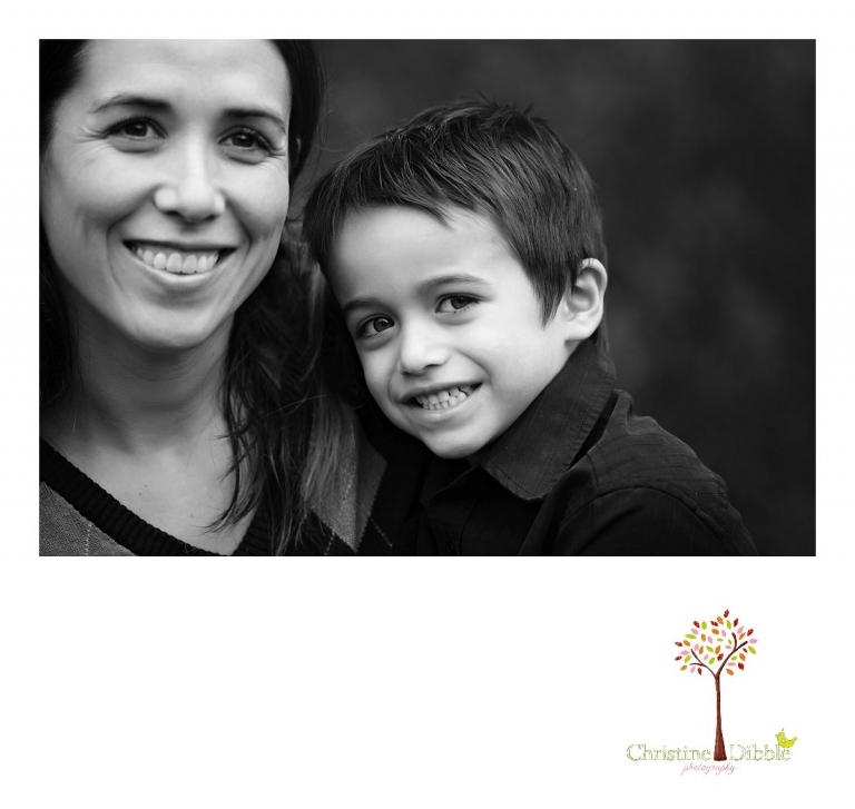 Sonora photographer Christine Dibble Photography takes a black and white photo of mom and her son during a  four generation family portraits outside on a foggy morning in the clients' yard.