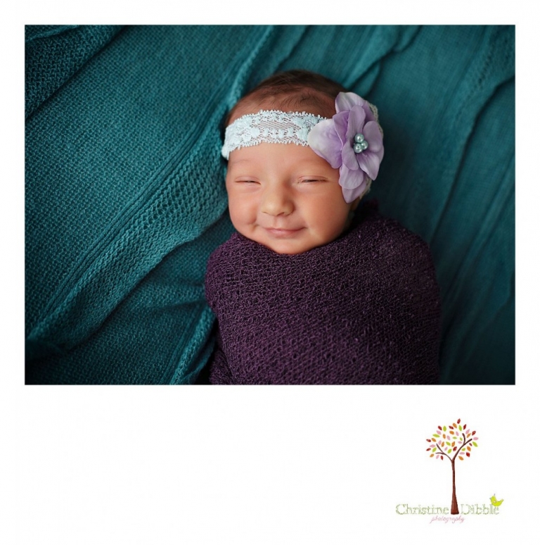 Best Sonora newborn photographer Christine Dibble Photography takes a portrait of a smiling baby girl.