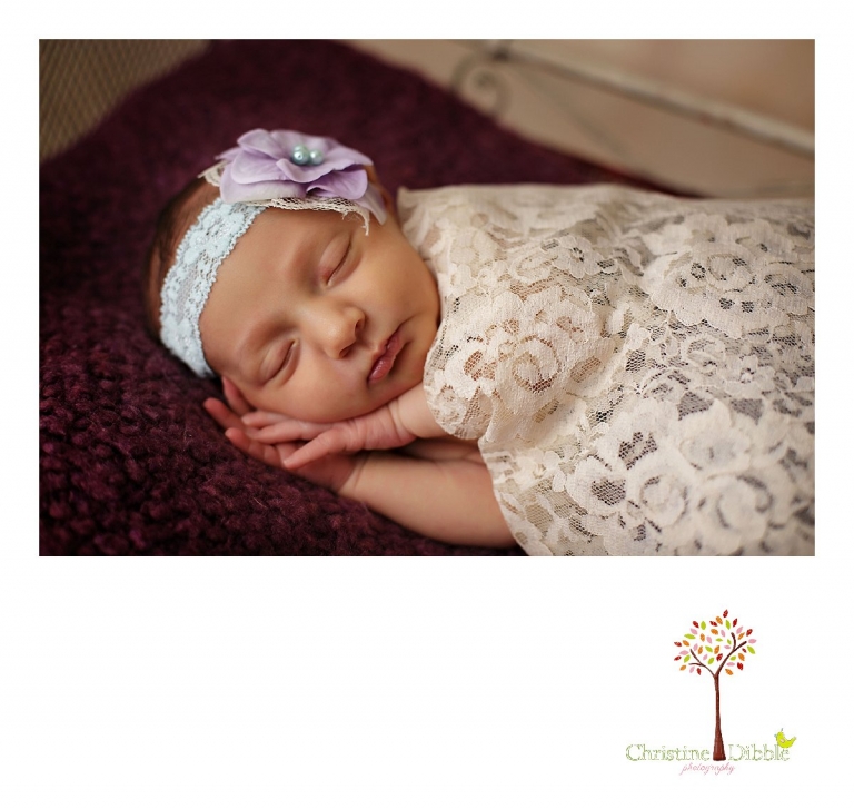 Best Sonora newborn photographer Christine Dibble Photography takes portraits of an eight day old newborn baby girl as she sleeps in a miniature iron bed.