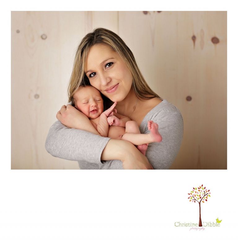 Best Sonora newborn photographer Christine Dibble Photography takes portraits of an eight day old newborn baby girl as she sleeps in mom's arms.