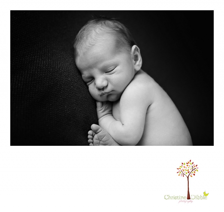 Sonora newborn photography session by Christine Dibble Photography captures a sleeping baby boy in a black and white image.